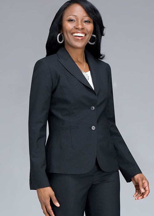 Picture of black woman dressed up in a dark gray or black interview pants suit.